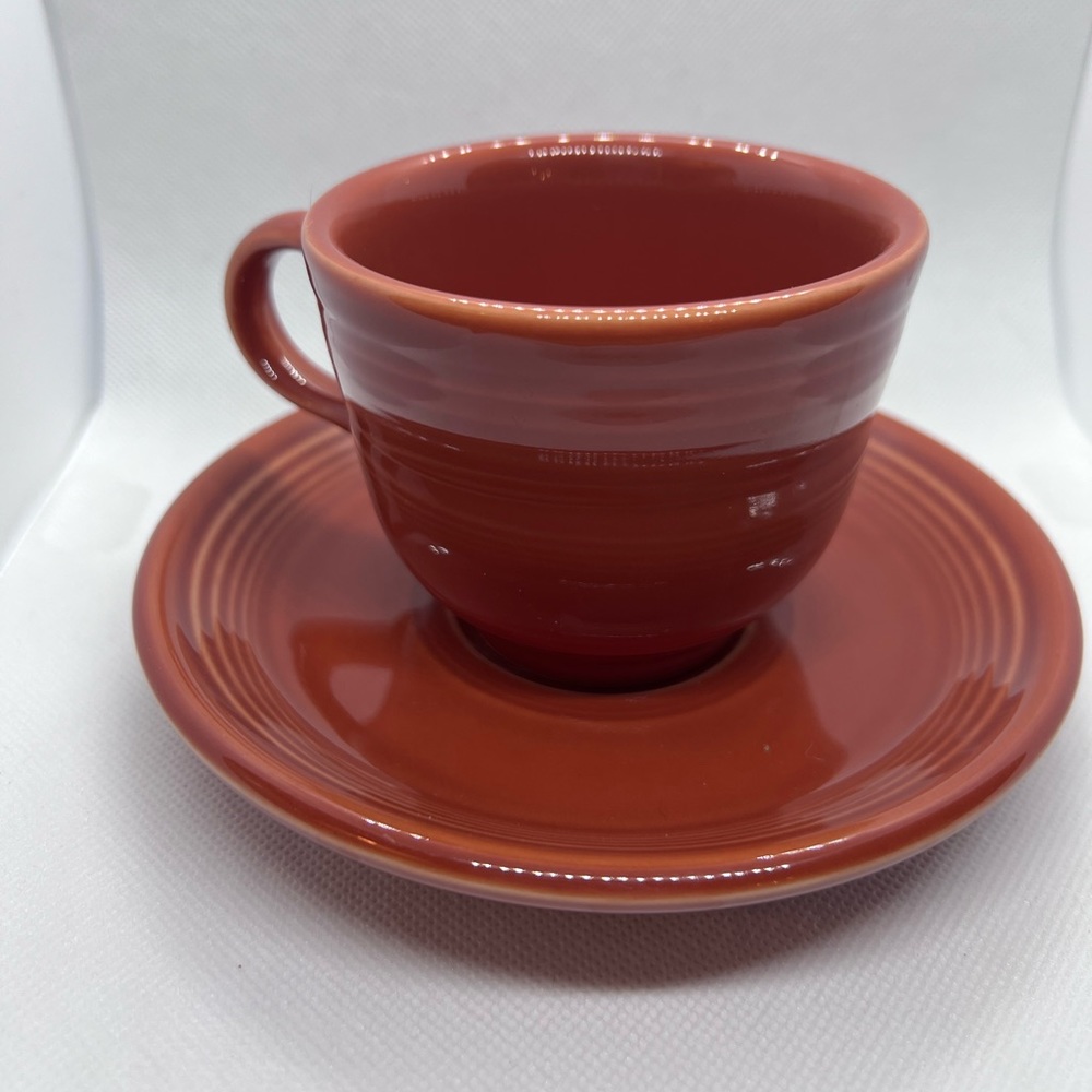 Fiestaware Paprika tea cup and matching saucer. Retired color. Like new